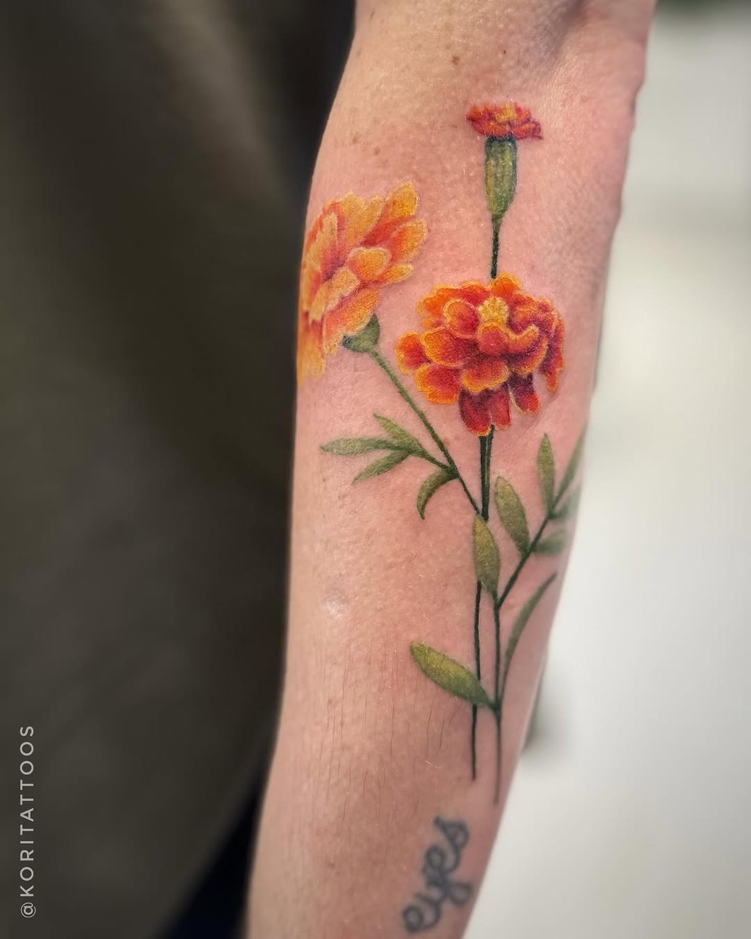 Stunning Marigold Tattoo with Bold Colors Tattoo Design