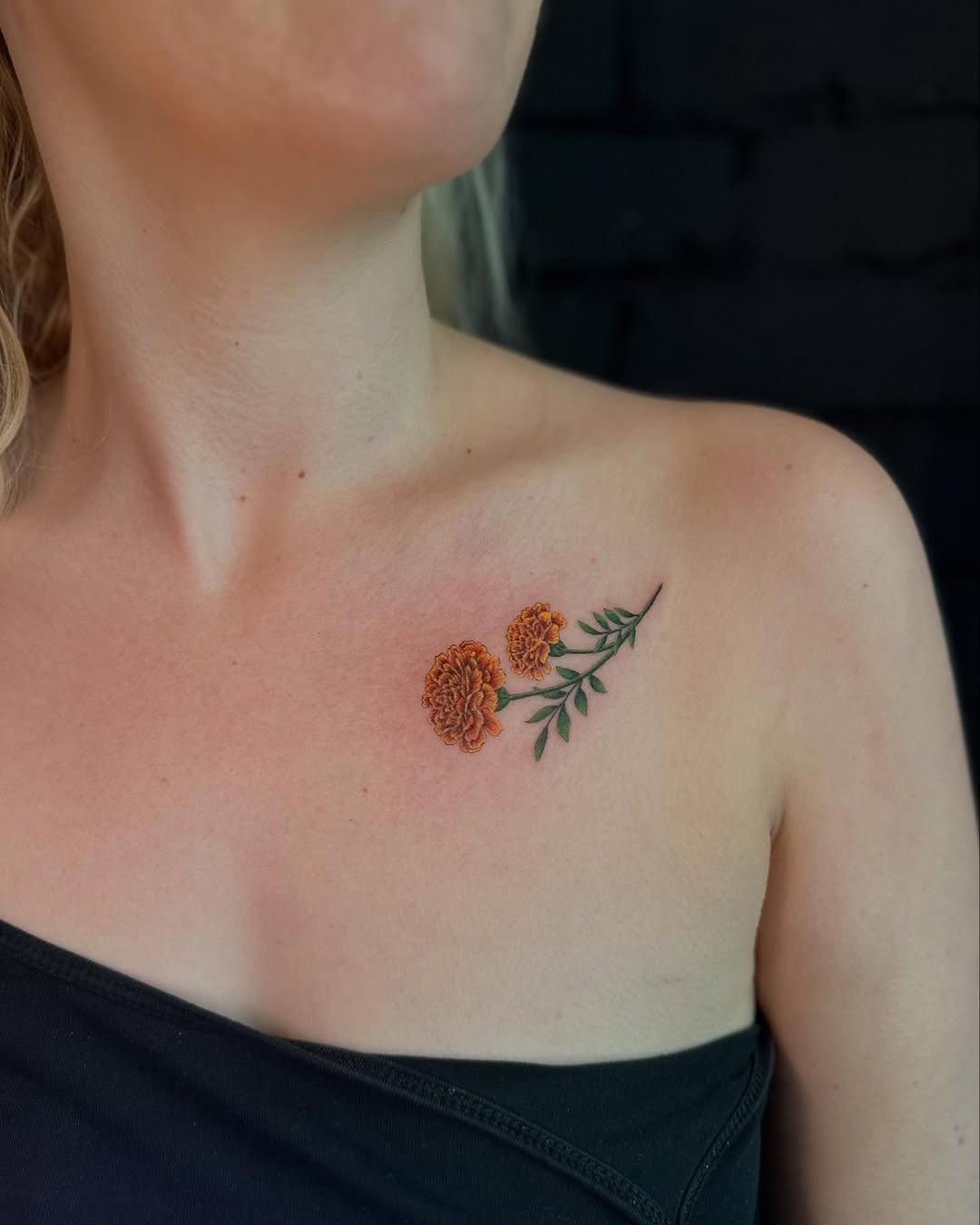 Vibrant marigold tattoo on shoulder area Tattoo Design