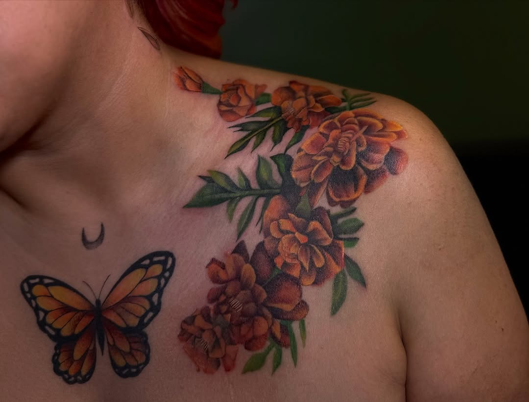 Vibrant marigold tattoo with butterfly detail Tattoo Design