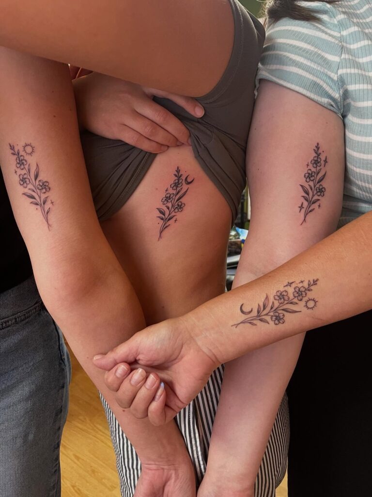 Matching Floral Tattoos with Sun and Moon Symbols Tattoo Design