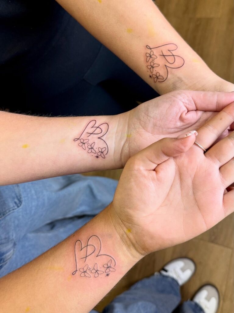 Matching Heart and Flower Tattoos for Sisters Tattoo Design