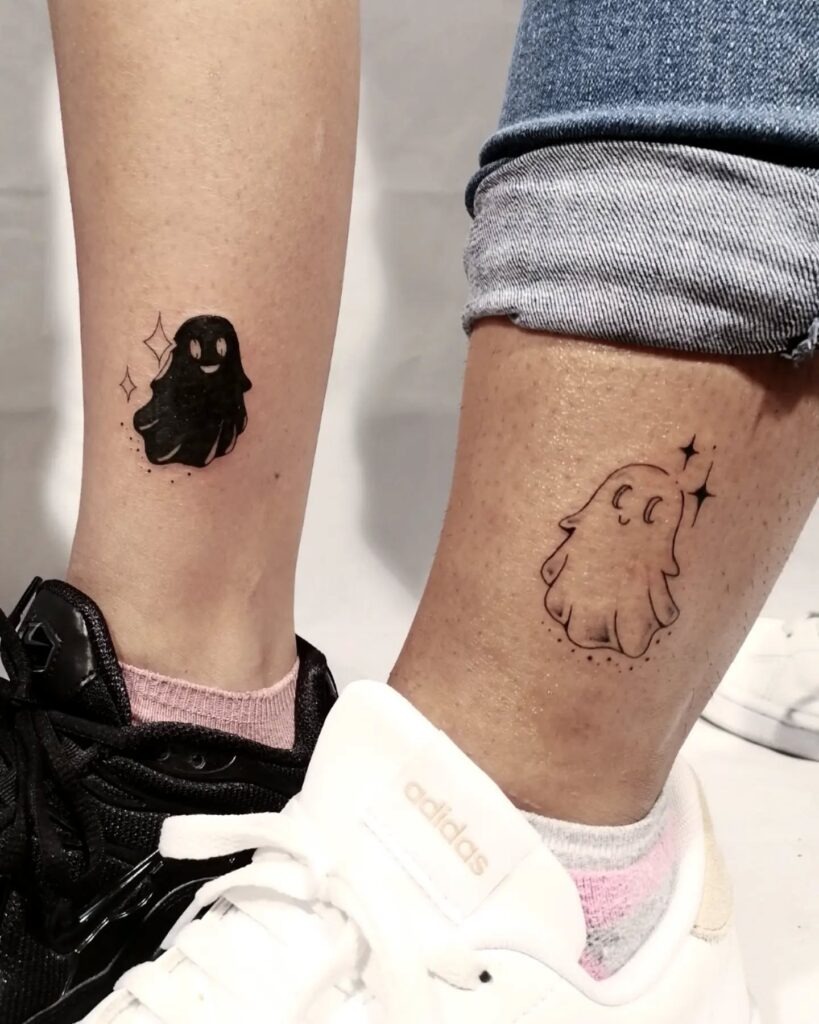 Matching Ghost Tattoos in Black and White Contrast Tattoo Design
