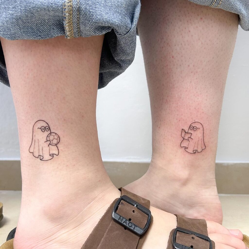 Matching Ghost Tattoos with Soccer Ball and Book Tattoo Design