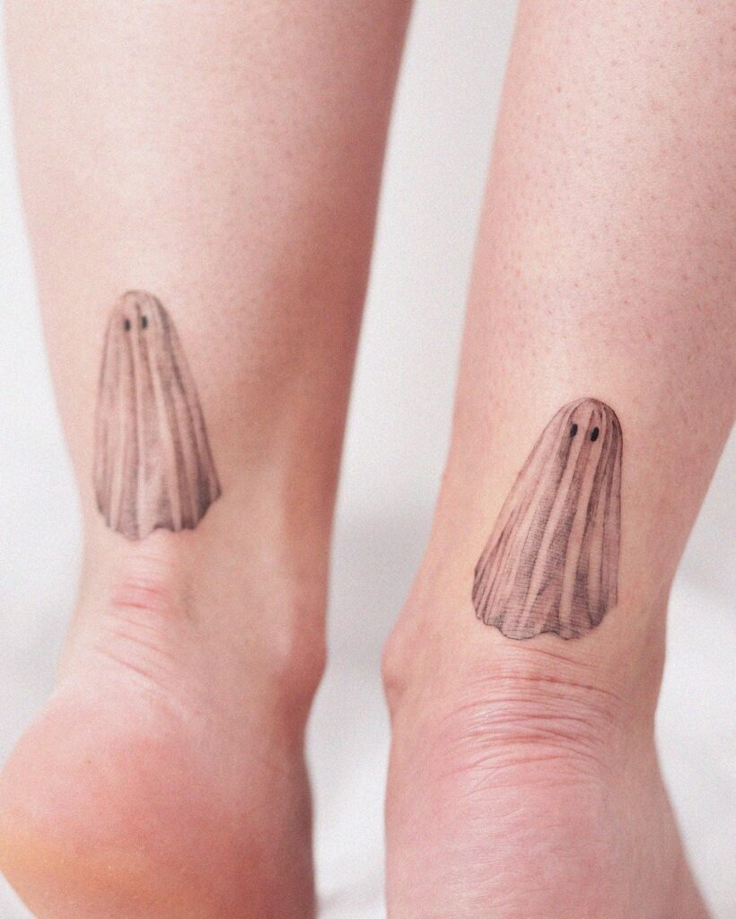 Matching Minimalist Ghost Tattoos on Ankles Tattoo Design