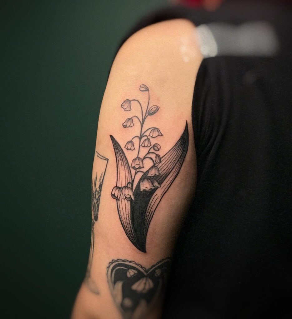 Bold Lily of the Valley Upper Arm Tattoo Tattoo Design