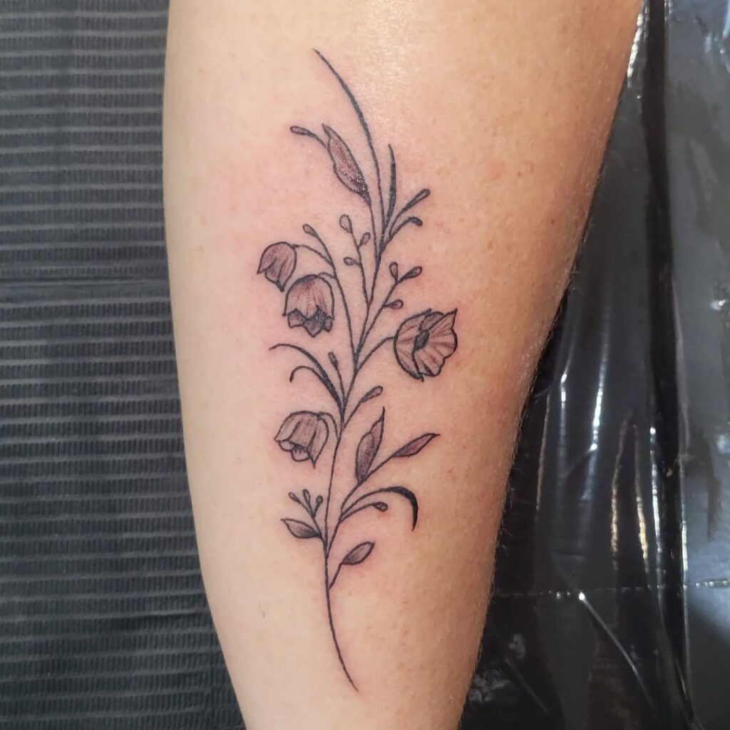 Delicate Lily of the Valley Hand Tattoo Tattoo Design