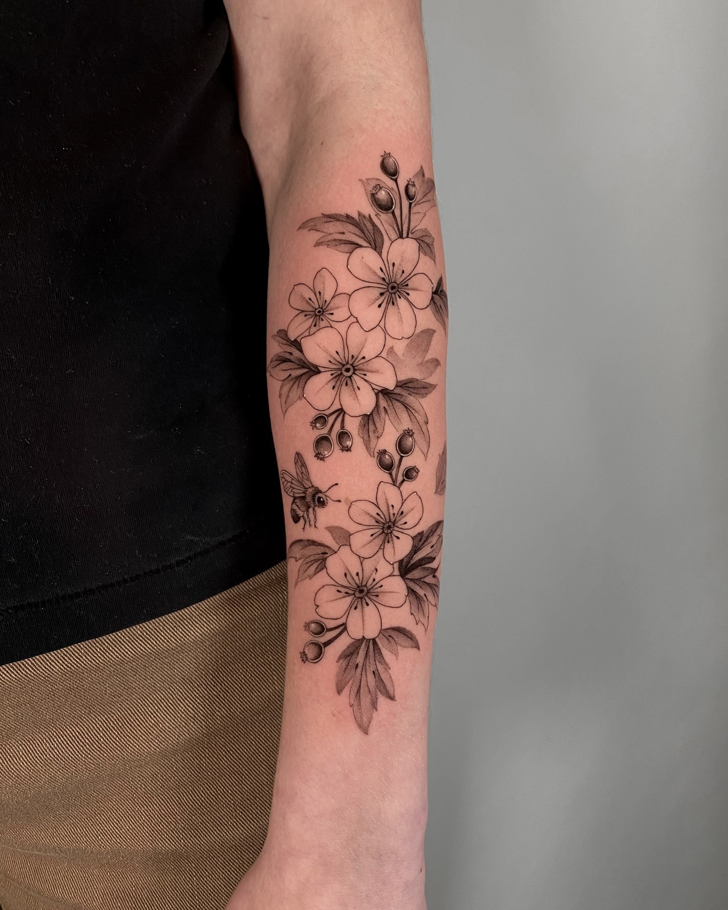 Detailed Hawthorn Blossom Forearm Tattoo with Bee Tattoo Design