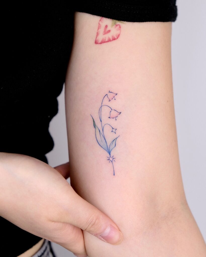 Minimalist Lily of the Valley Tattoo in Soft Colors Tattoo Design