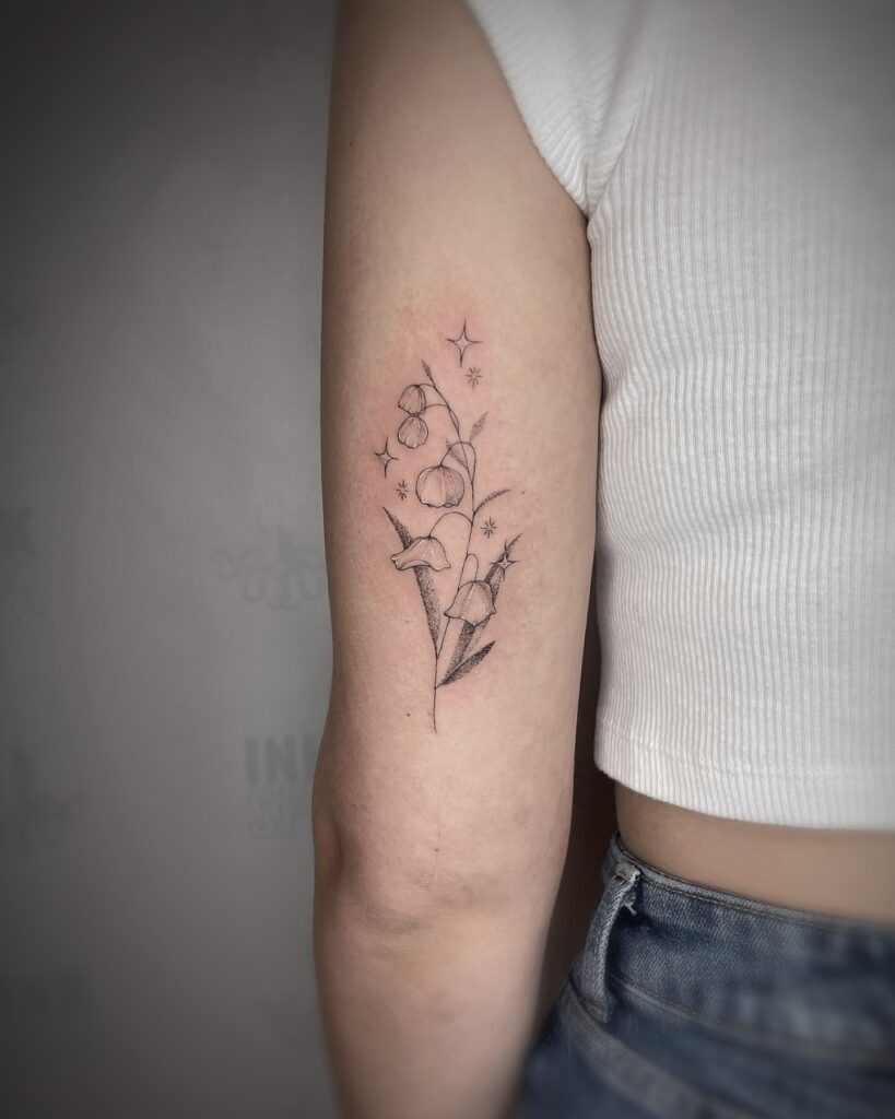 Sparkling Lily of the Valley Upper Arm Tattoo Tattoo Design