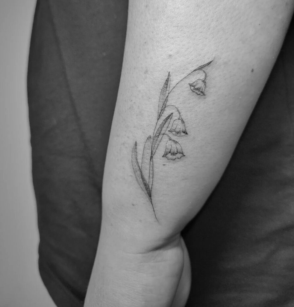 Subtle Lily of the Valley Elbow Tattoo Tattoo Design