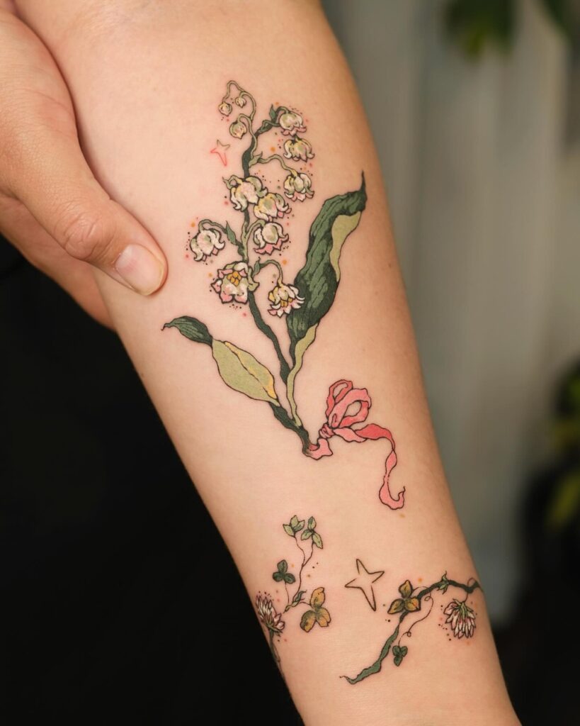 Whimsical Lily of the Valley Tattoo with Ribbon Detail Tattoo Design