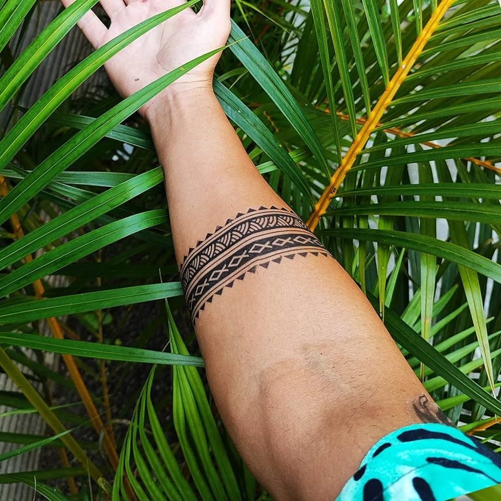 Feather Charm Wrist Tattoo Tattoo Design