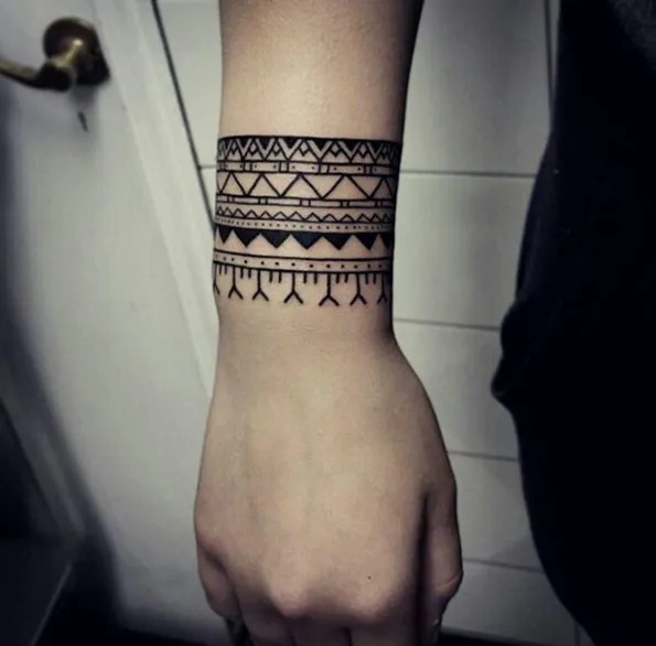 Tribal Patterns with Geometric Flair Tattoo Design