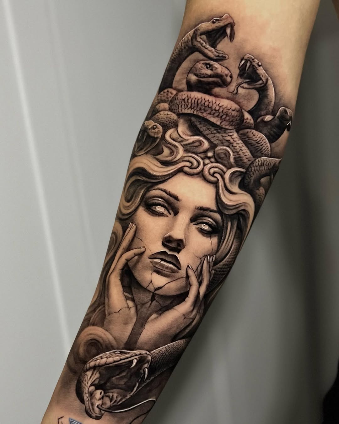 Elegant Medusa tattoo with serpentine details Tattoo Design