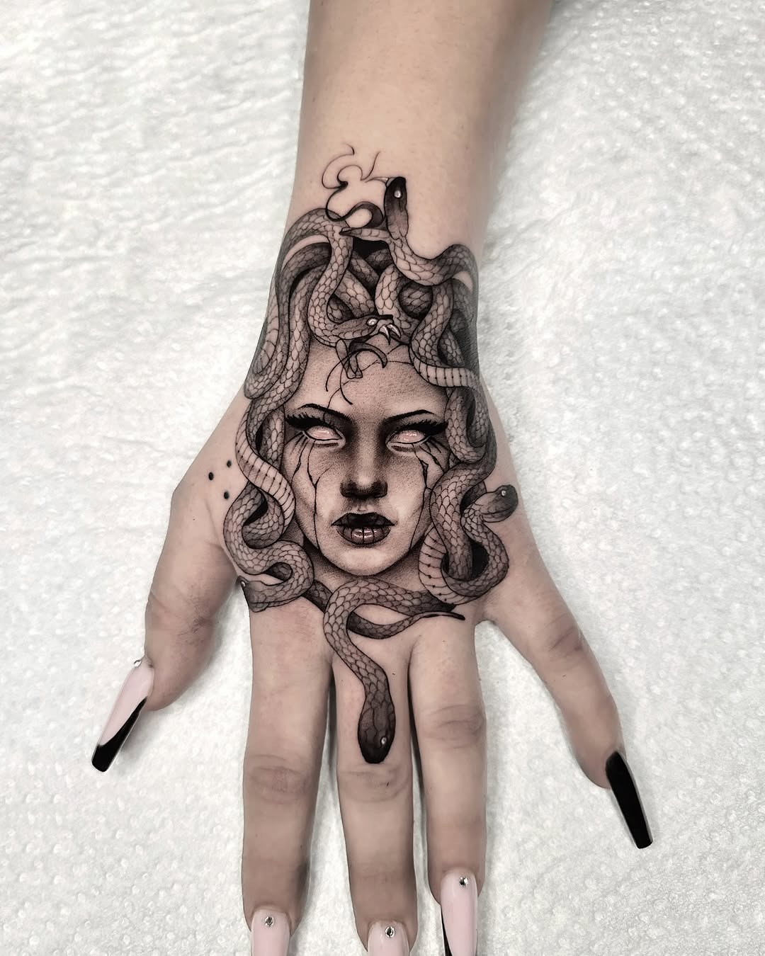 Intricate Medusa Hand Tattoo with Snakes Tattoo Design