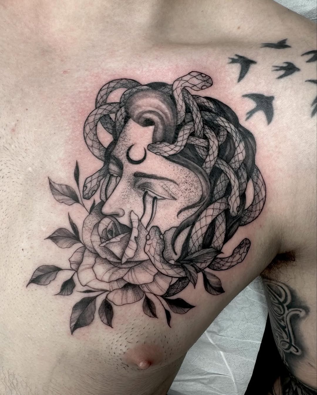 Intricate Medusa Tattoo with Floral Elements Tattoo Design