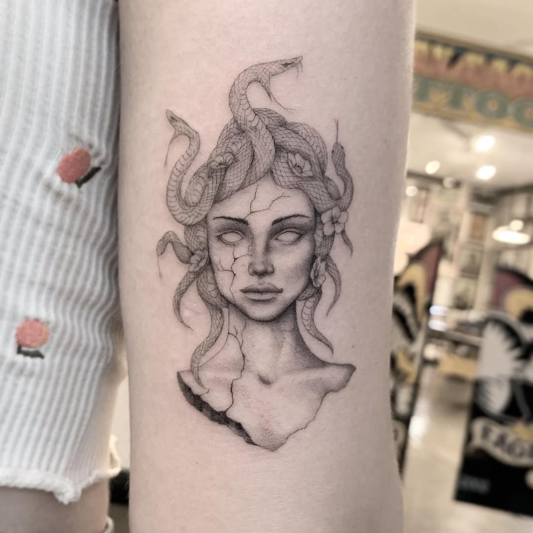 Intricate Medusa Tattoo with Snakes and Flowers Tattoo Design