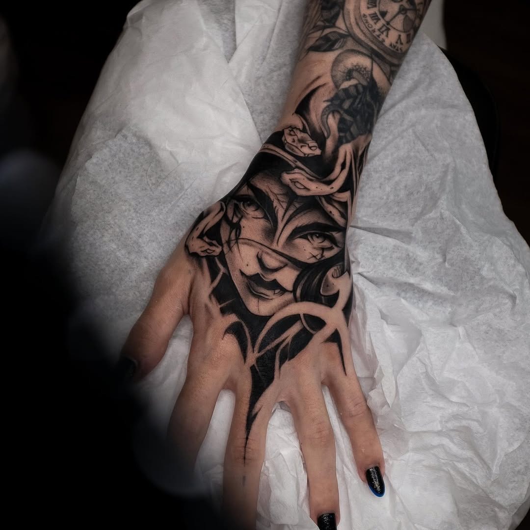 Striking Medusa Hand Tattoo with Intricate Details Tattoo Design