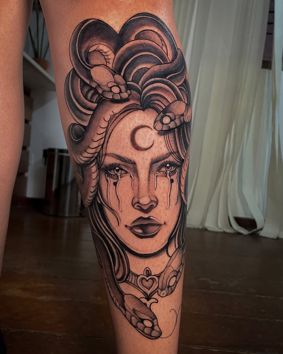 Striking Medusa Leg Tattoo with Mystical Elements Tattoo Design