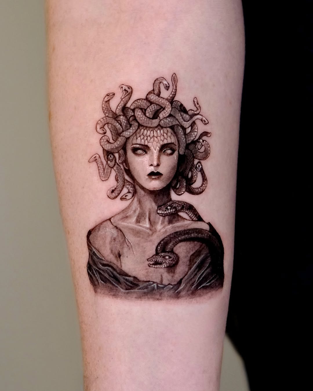 Striking Medusa Tattoo with Serpentine Detail Tattoo Design