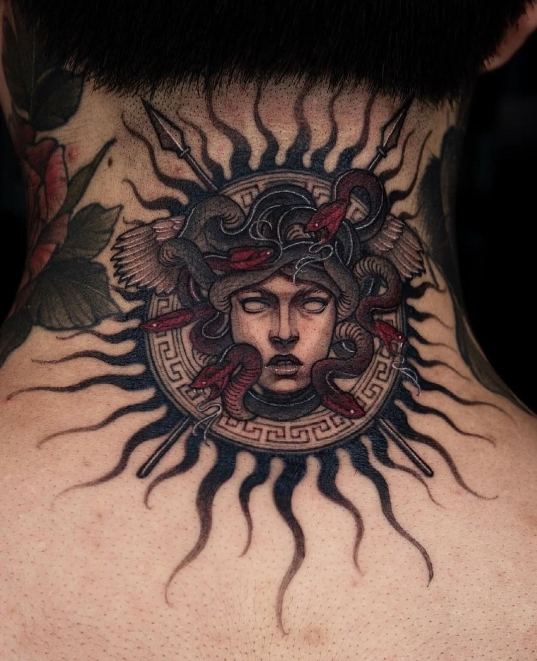 Striking Medusa Tattoo with Sun Motif Tattoo Design