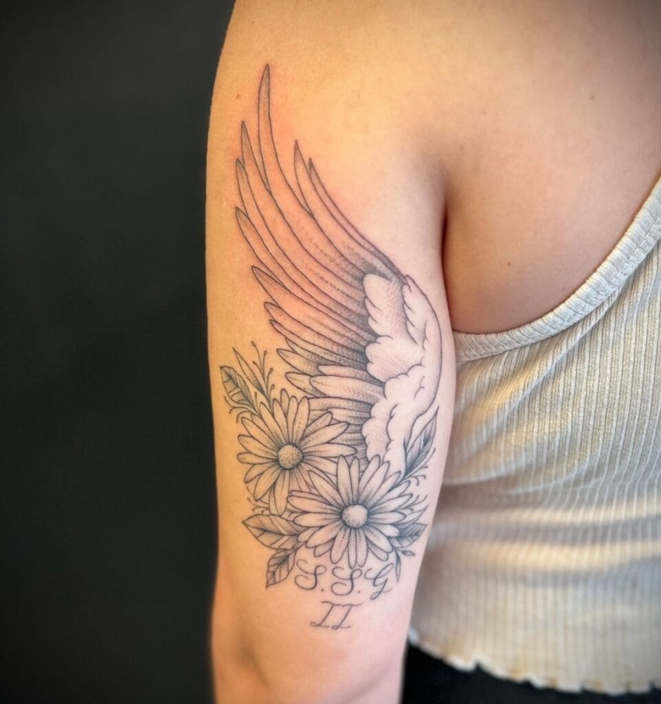 Angel Wings Adorned with Halo & Baby Footprints Tattoo Design