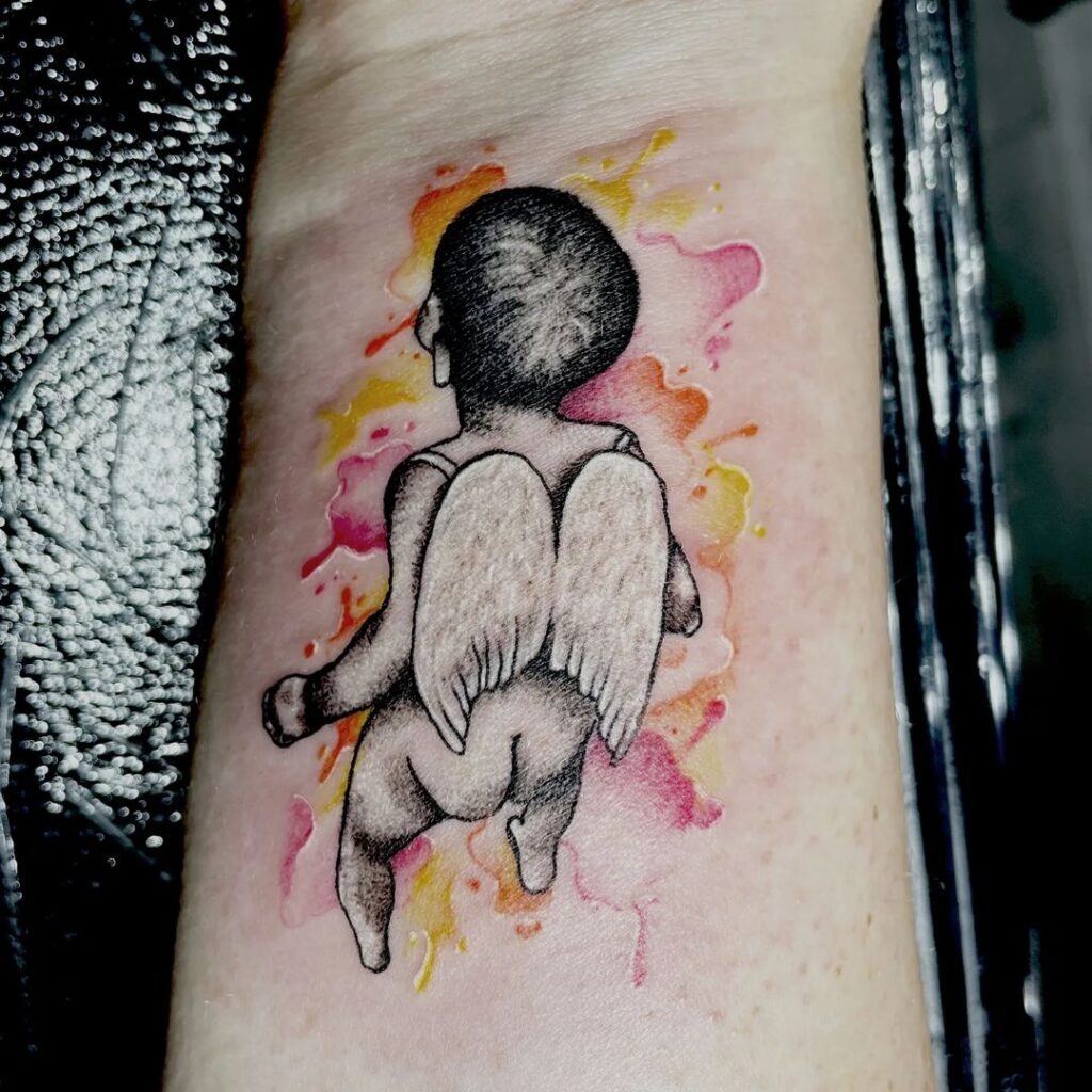 Two Doves Soaring above a Child’s Face Tattoo Design