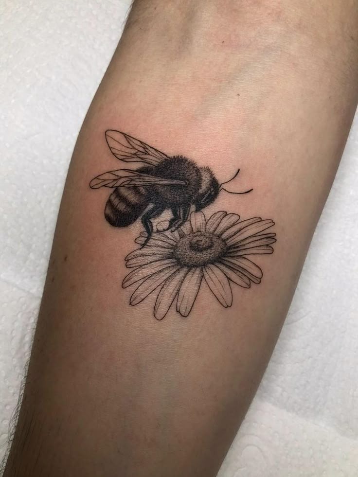Black and White Bee on Daisy Tattoo Design