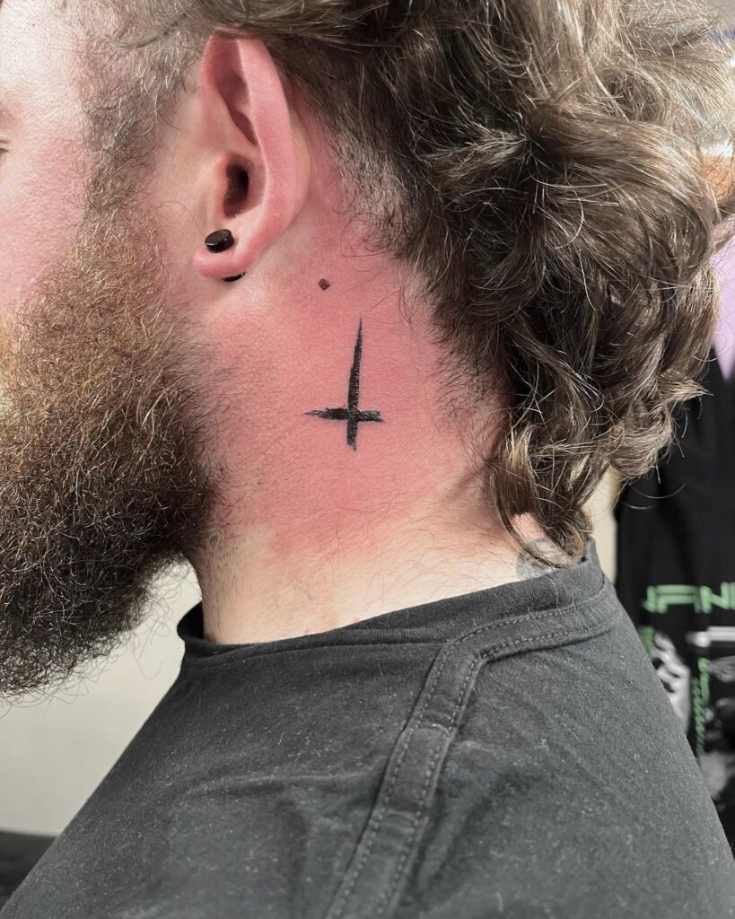 Bold Minimalist Cross Behind the Ear Tattoo Design