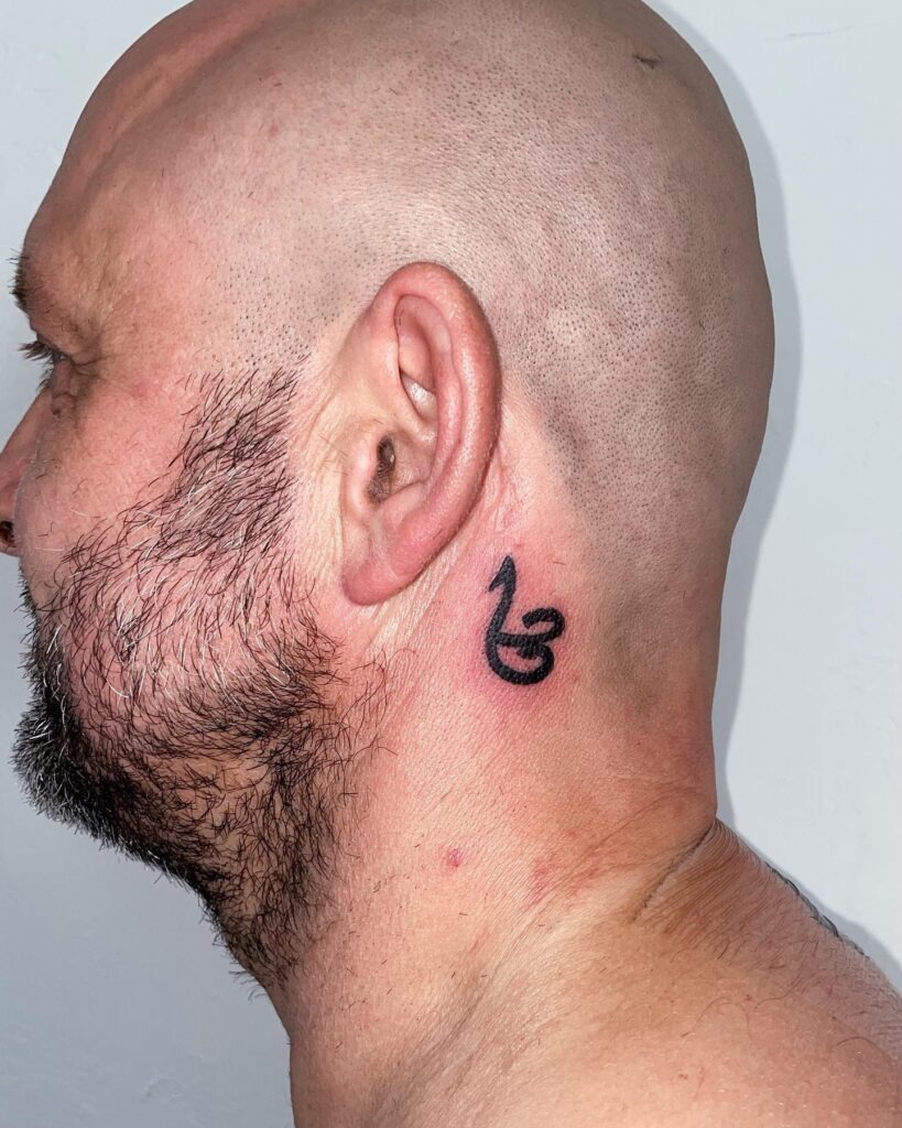 Bold Strength Symbol Behind the Ear Tattoo Design