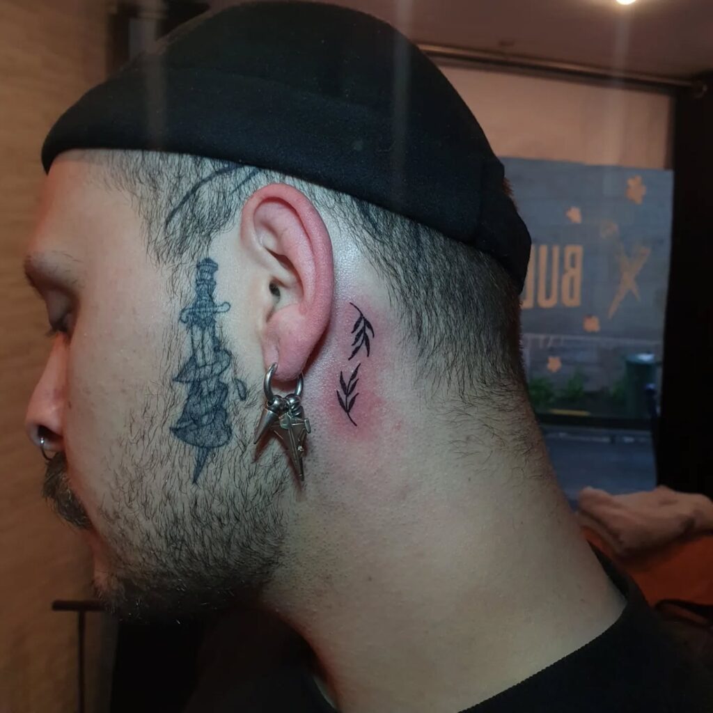 Minimal Leaf Sprigs Behind the Ear Tattoo Design