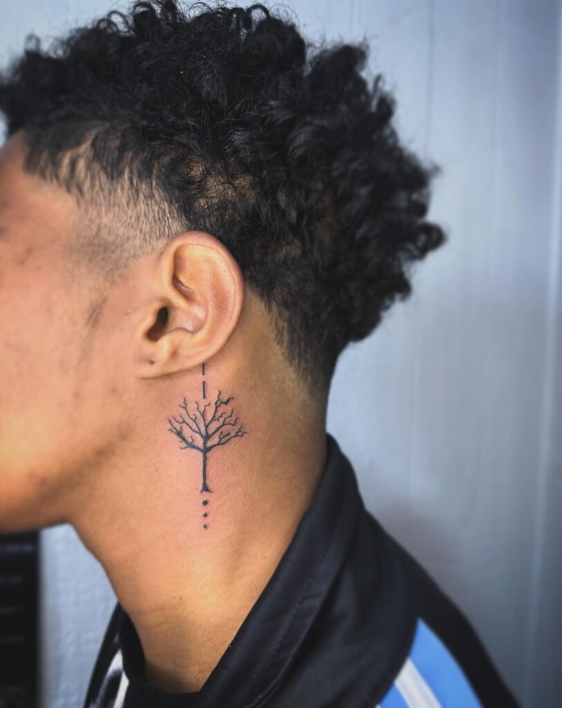 Minimal Tree Silhouette Behind the Ear Tattoo Design