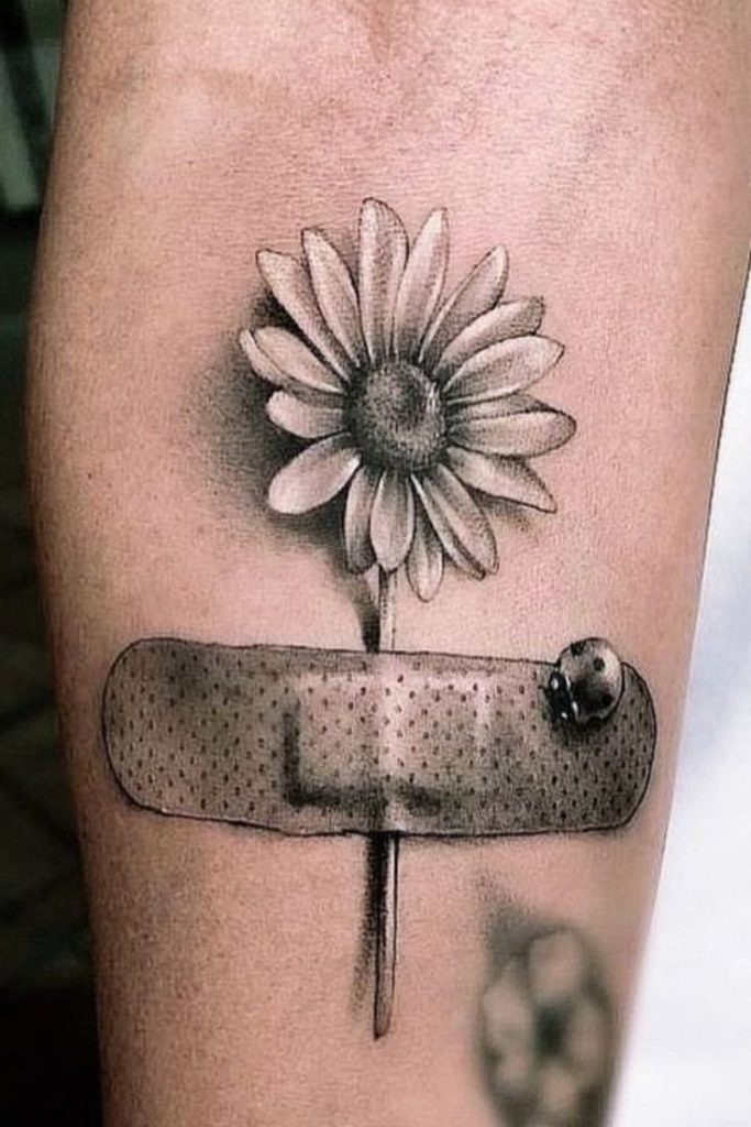 A beautiful daisy seems to grow from behind a realistic bandage in this clever, easy to draw design.