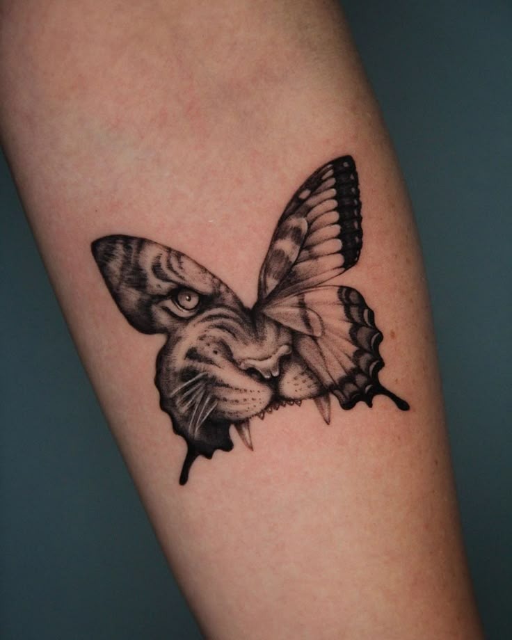 This creative hybrid of a tiger's face and a butterfly wing is a masterpiece in metaphor.
