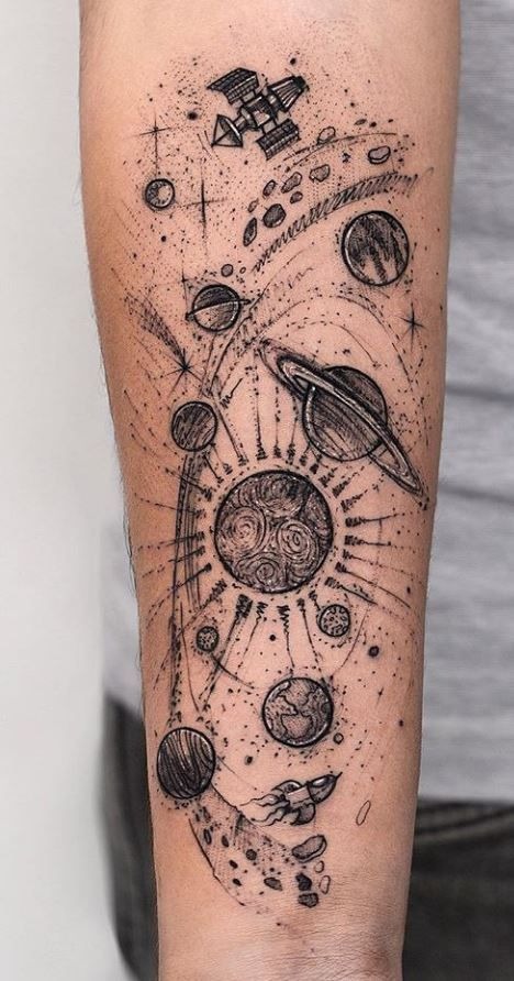 This tattoo captures the grandeur of the cosmos in an epic spiral layout.