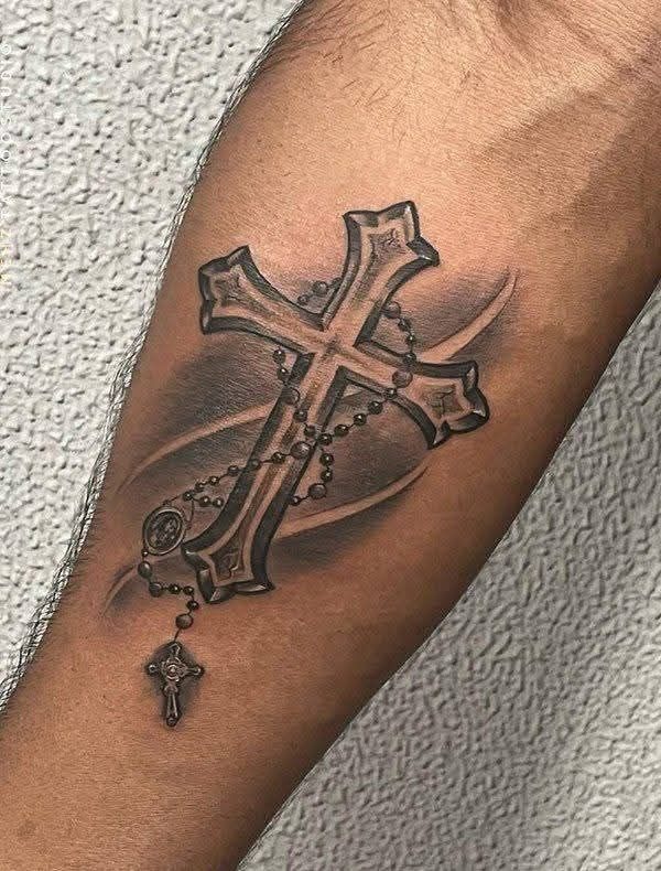 This tattoo design captures devotion and protection in one elegant mark.