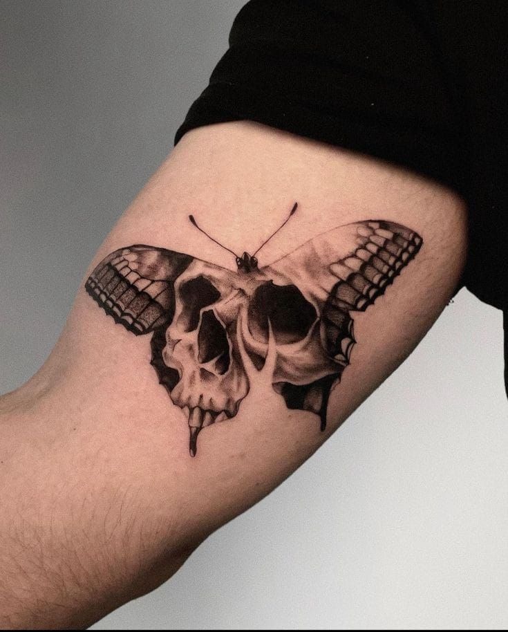 Here, a butterfly's wings give life to a skull's contours, turning a symbol of death into something hauntingly beautiful.