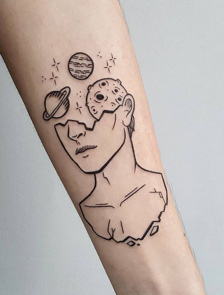 This avant-garde tattoo shows a man's bust breaking apart, with his head giving way to planets and moons.