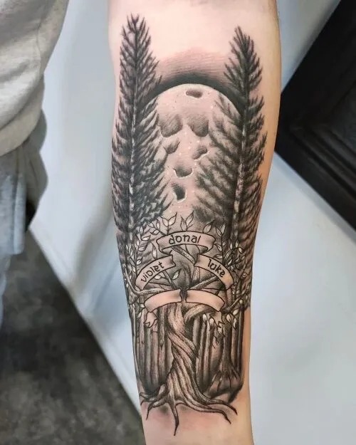 This tattoo elegantly spans the forearm, showing two towering trees with interwoven roots at the base.