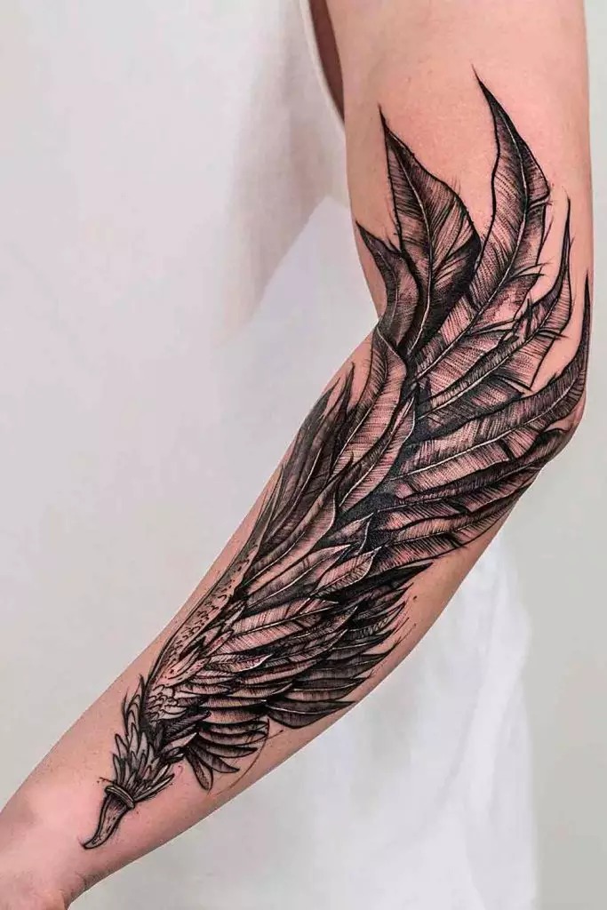 Wing-Inspired Arm Piece Tattoo Design