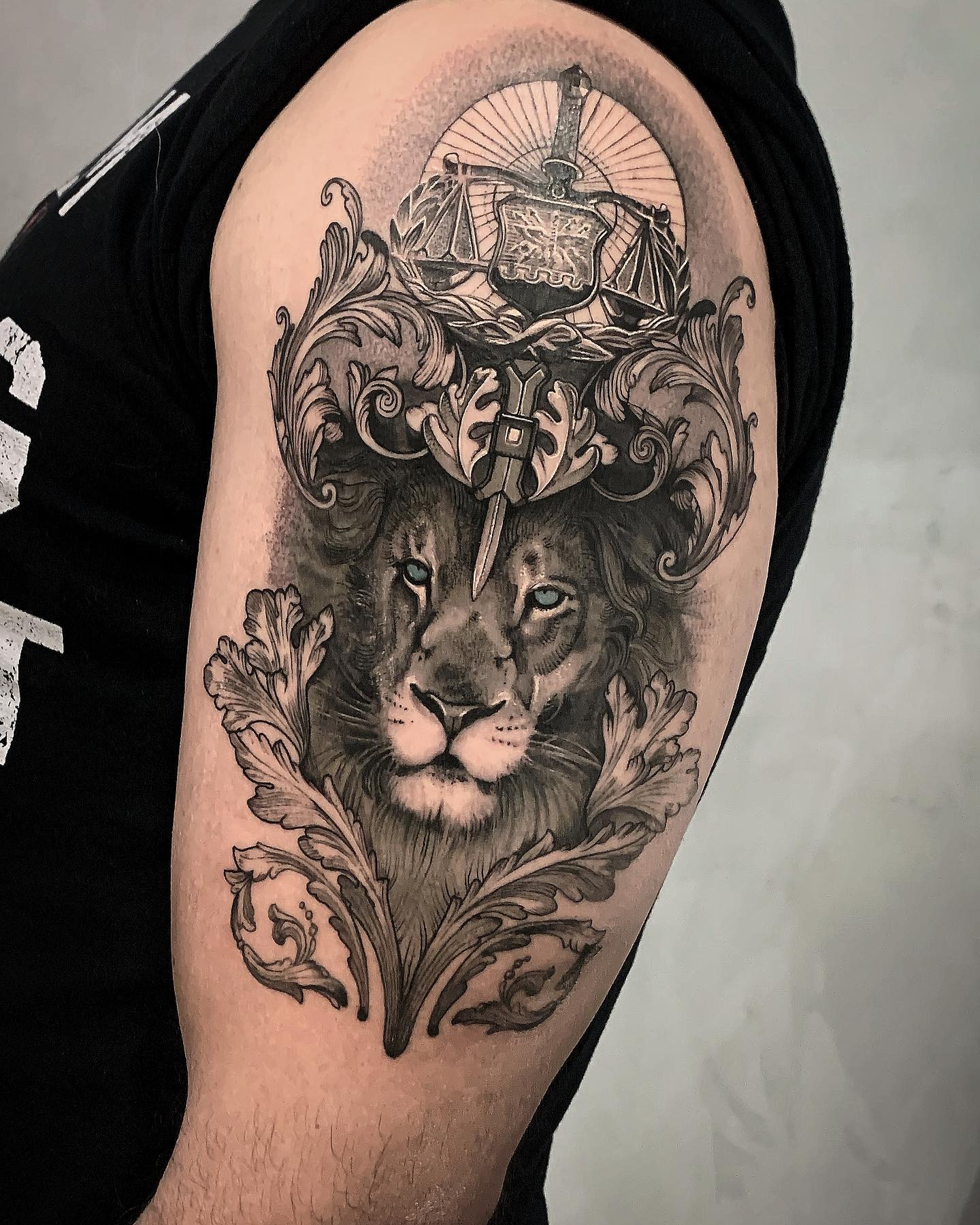 Lion and Scales of Justice Half Sleeve Tattoo Tattoo Design
