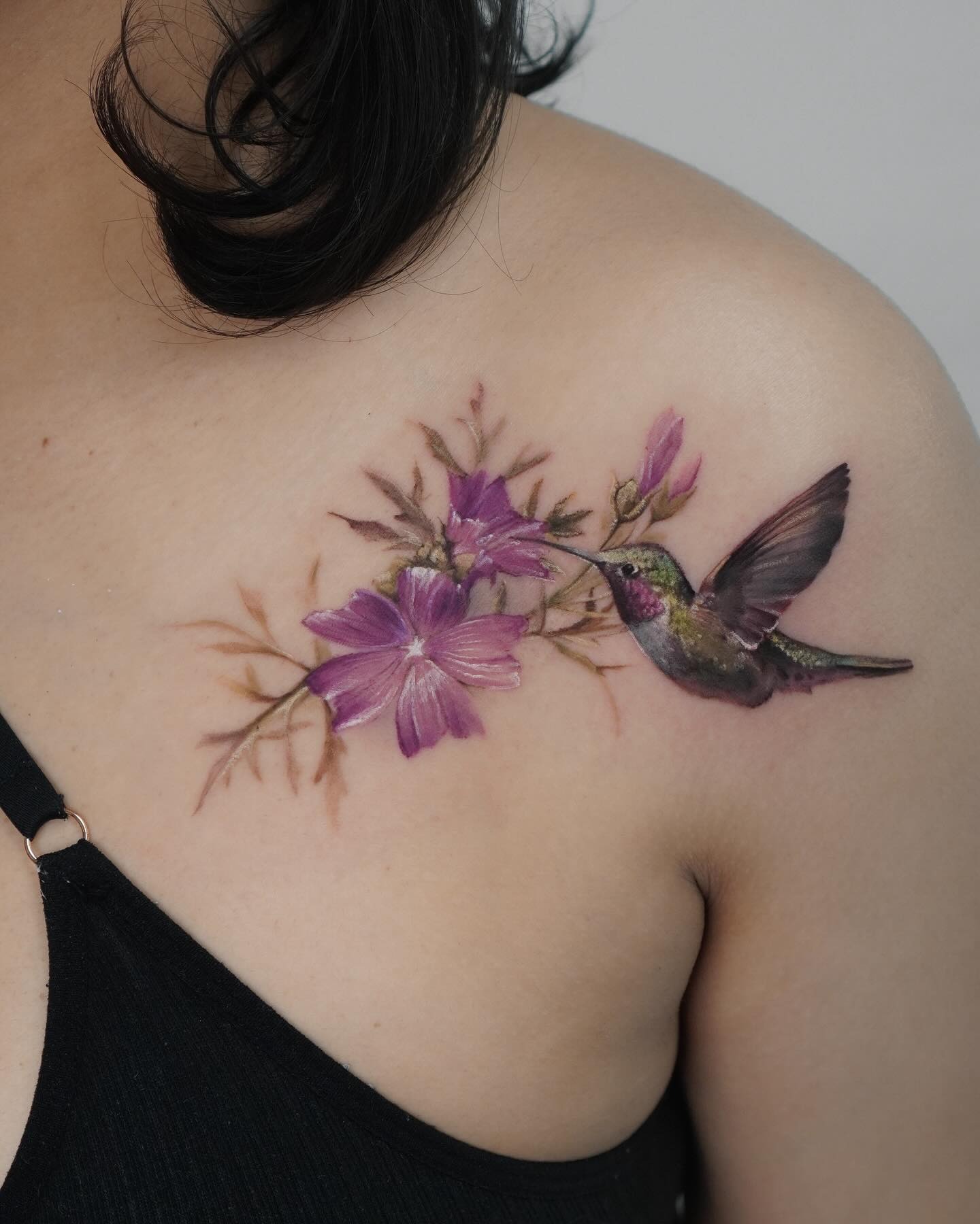 Black and Grey Hummingbird with Blooming Florals Tattoo Design