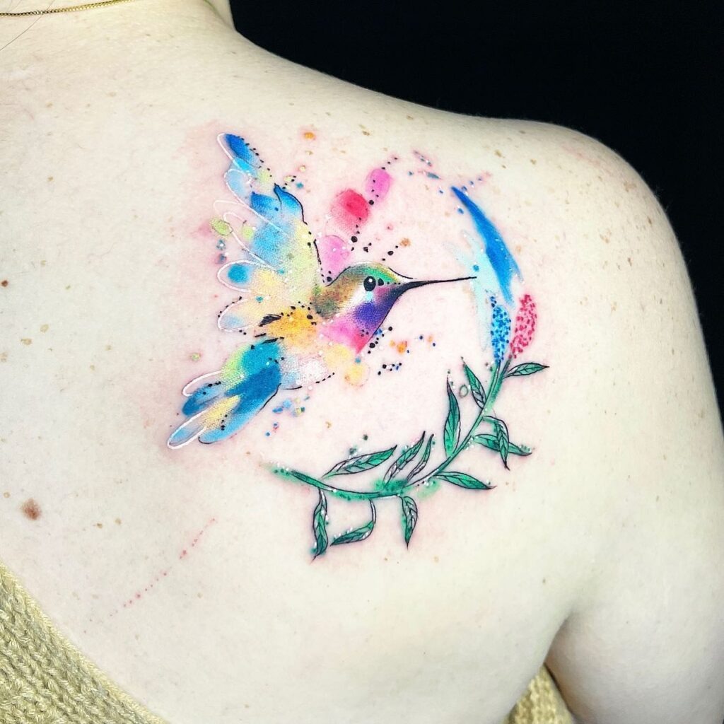 Bright Rainbow Hummingbird on Forearm Tattoo Design
