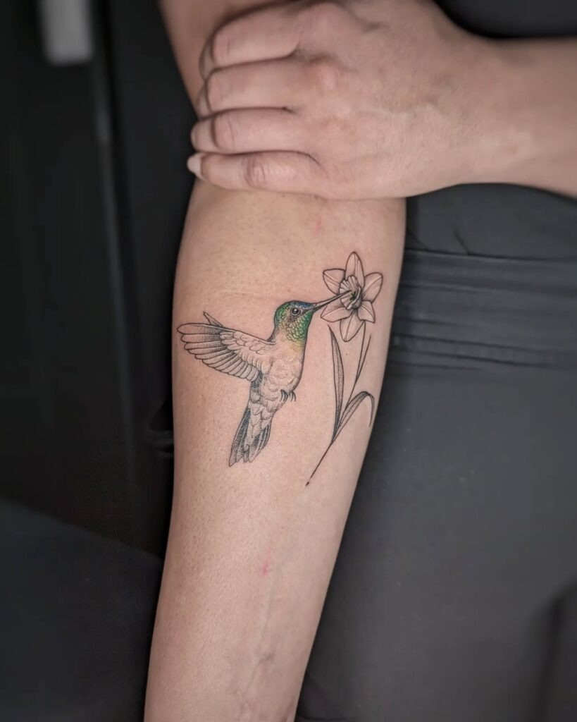 Colorful Hummingbird with Bleeding Heart Flowers Tattoo Design