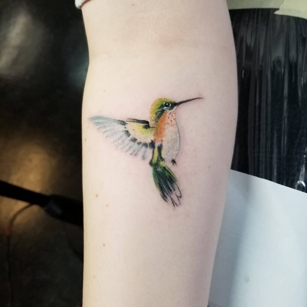 Graceful Hummingbird on Upper Back Tattoo Design