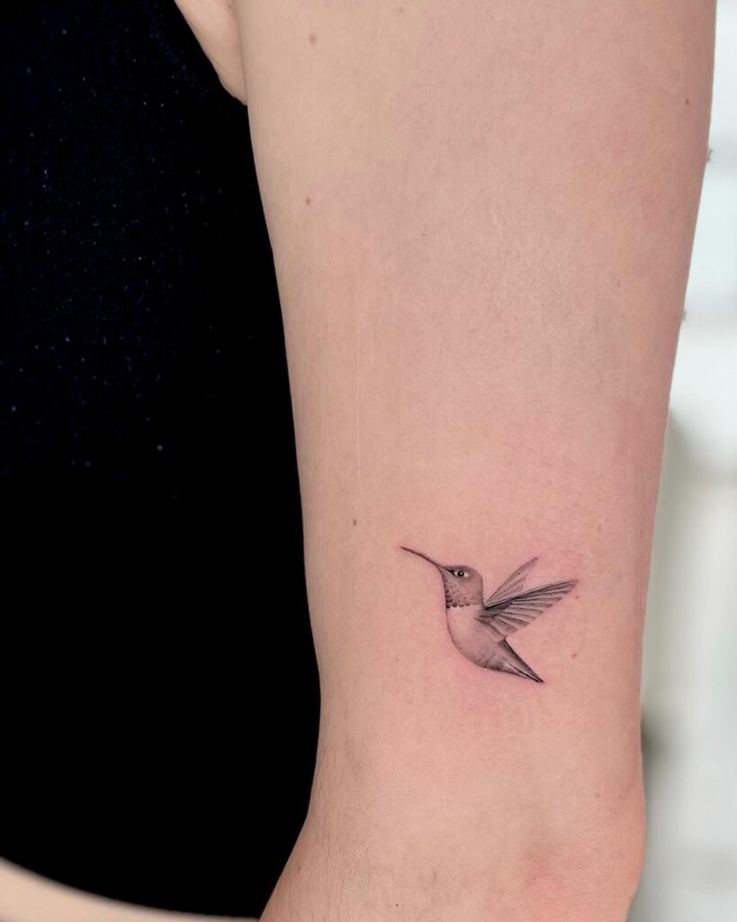 Graceful Hummingbird with Flowing Branches Tattoo Tattoo Design