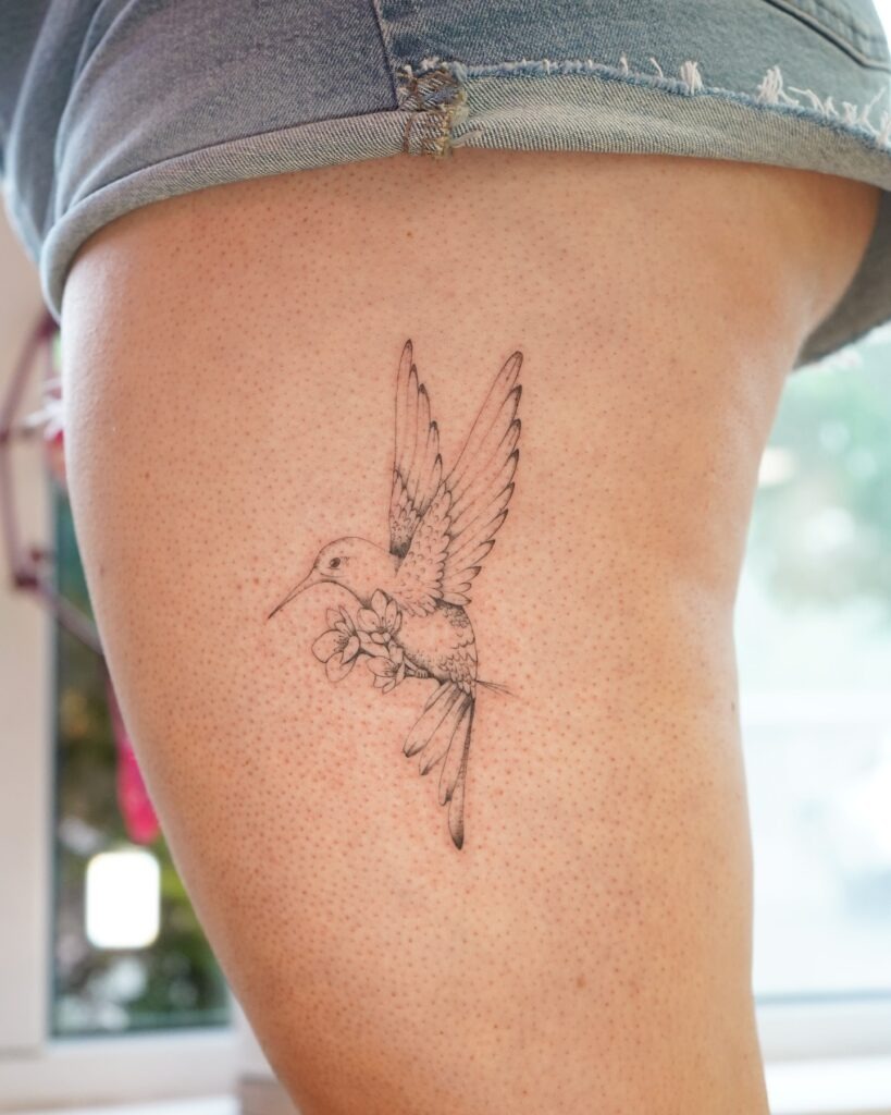 Large Linework Hummingbird on Ribcage Tattoo Design