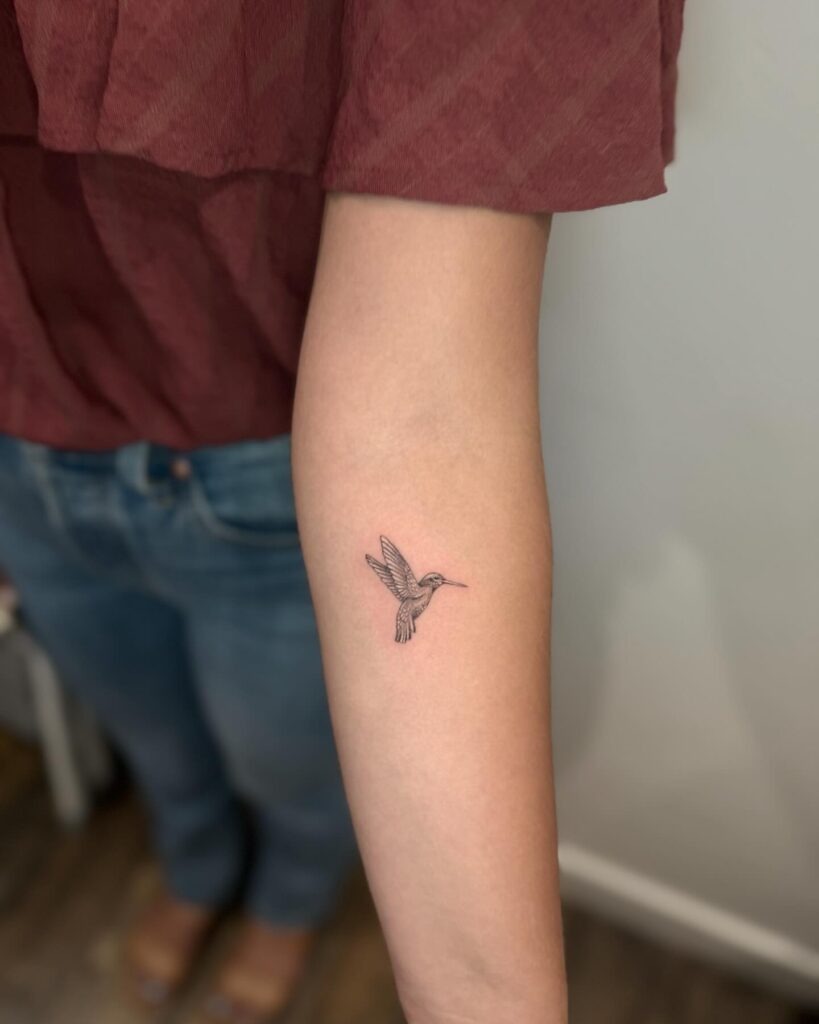 Lightly Detailed Hummingbird with Blossoms on Thigh Tattoo Design