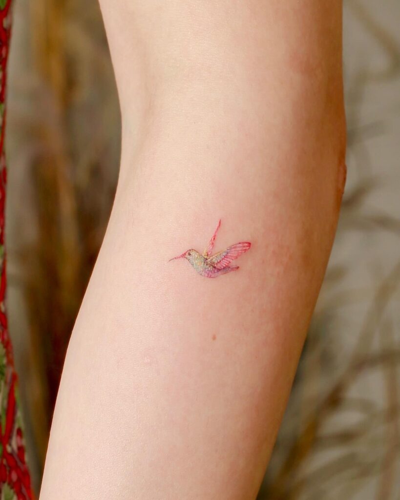 Soft Watercolor Hummingbird on Back Shoulder Tattoo Design