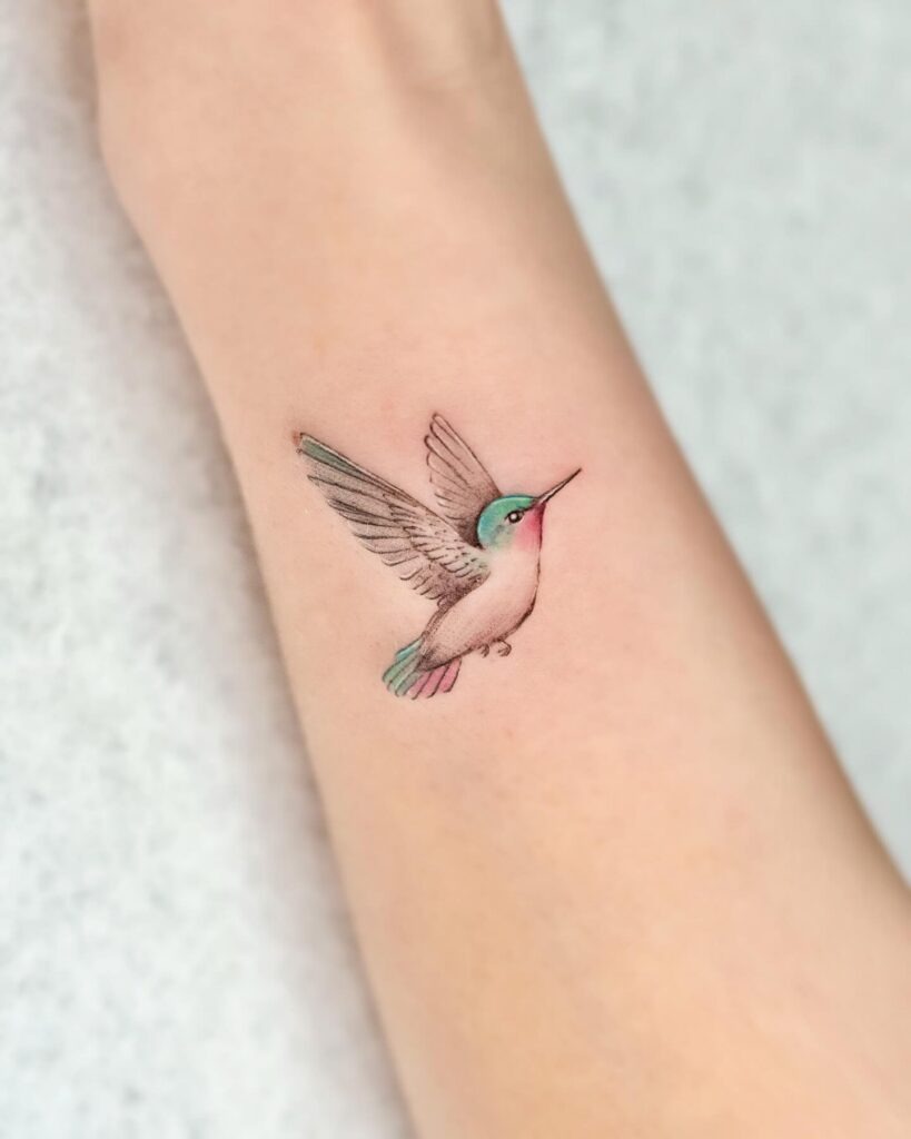 Tiny Realistic Hummingbird on Hip Tattoo Design